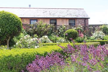 Peeking across at The Old Stables, nestled discreetly behind an array of carefully placed shrubbery.