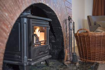The spacious sitting-room with wood-burner is the perfect spot to settle down and sunggle up to watch your favourite movie