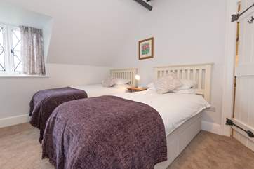 Bedroom three, another twin bedroom, is located on the first floor to the rear of the property and overlooks the garden