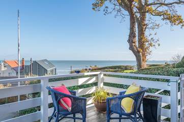 Sit out on the balcony and watch the sun go down on a summer's evening with a glas of wine