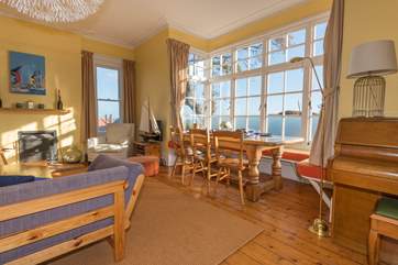 The large sitting-room with dining-area has stunning views across the Solent