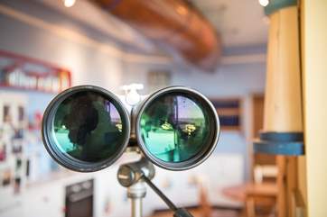The owner has provided binoculars so guests can look out to sea and watch the passing ships
