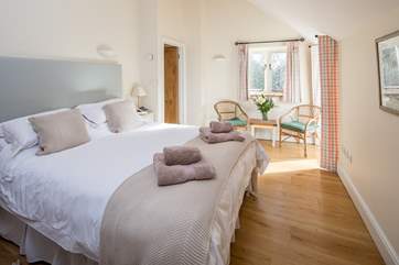 Bedroom 1 with a king-size bed is simply beautiful and the views over the rolling countryside are stunning.