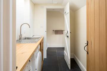 Downstairs you have an utility space and separate WC. A great space to store any supplies/equipment.