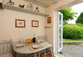 French windows lead from the kitchen/breakfast-room straight out into the large garden.