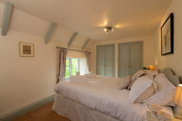 A second double bedroom also looks out over an orchard.