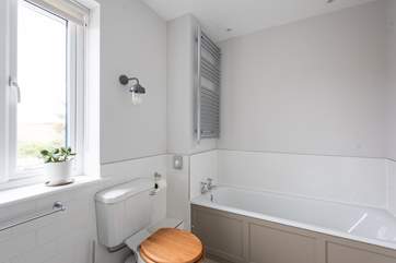 Enjoy a soak in the family bathroom.