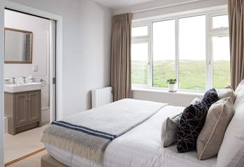 This bedroom has a stylish en suite shower-room. 