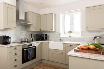 The kitchen is a lovely space to prepare a feast, wash up with a view.