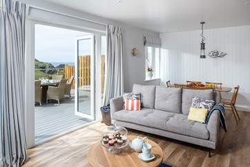 The open plan living space opens to the large terrace.