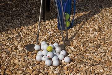 Clubs and plenty of balls are provided - such fun!