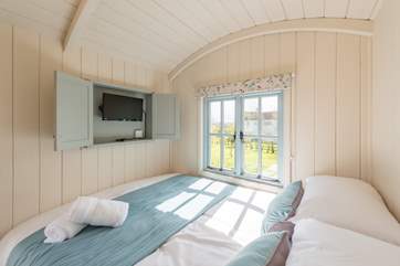 Surprise! There is a TV hidden away in front of the bed - perfect for lazy mornings.