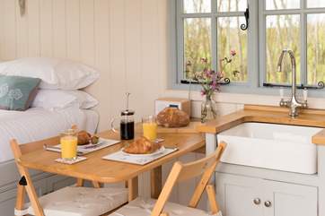 The handy dining-table folds down with ease, and can be popped away when not needed.