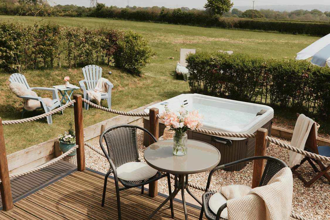 The bubbly hot tub adds to the magic of your romantic getaway.