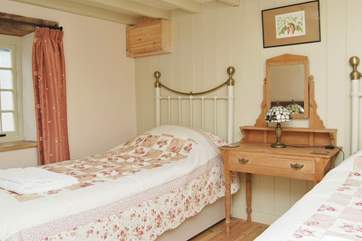 The ground floor twin bedroom. This bedroom is set next to the ground floor shower-room.