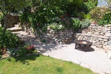 The fire pit, set in its own area of the garden with seating and, of course, views.