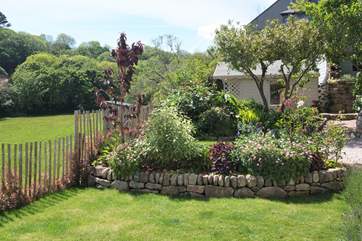 The lovely garden with the summer house in the background.
