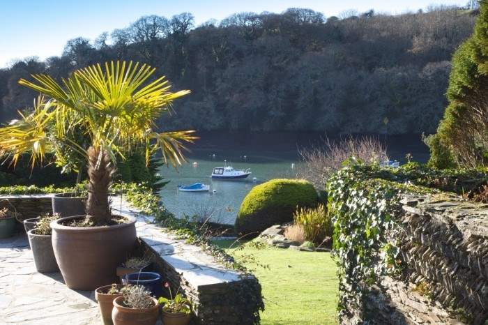 The pretty terrace leads down to a large lawn.