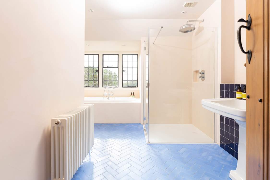 The family bathroom has a bath and large separate shower.