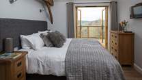 Bedroom 1 has a gorgeous 6ft 'zip and link' bed which can be split into two single 3ft beds and French doors leading onto the enclosed terrace.