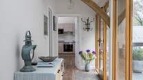 This glass fronted corridor links the bedrooms to the open plan living space.