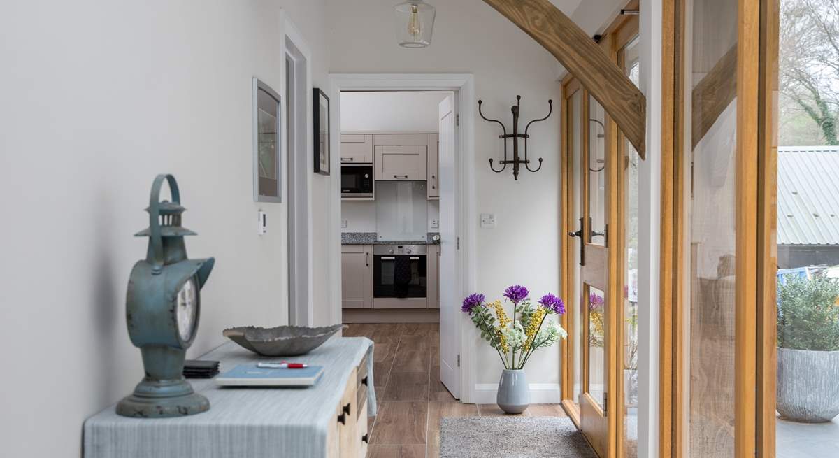 This glass fronted corridor links the bedrooms to the open plan living space.