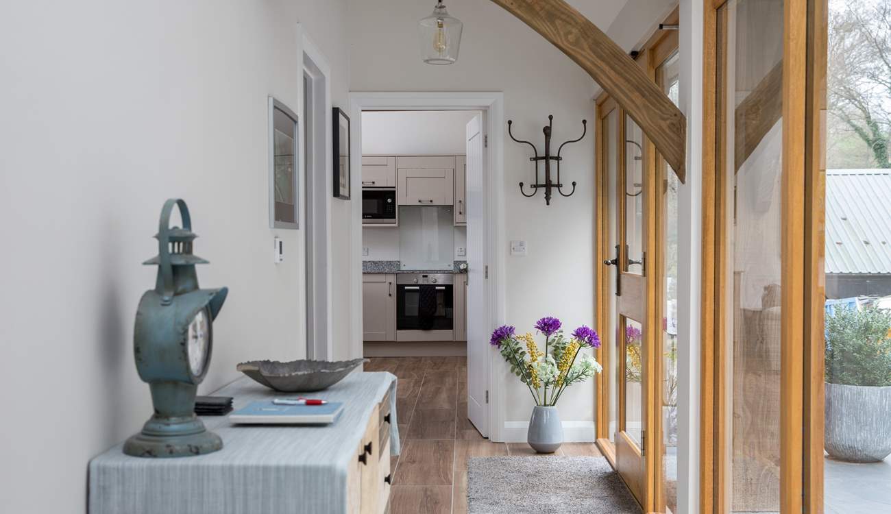 This glass fronted corridor links the bedrooms to the open plan living space.