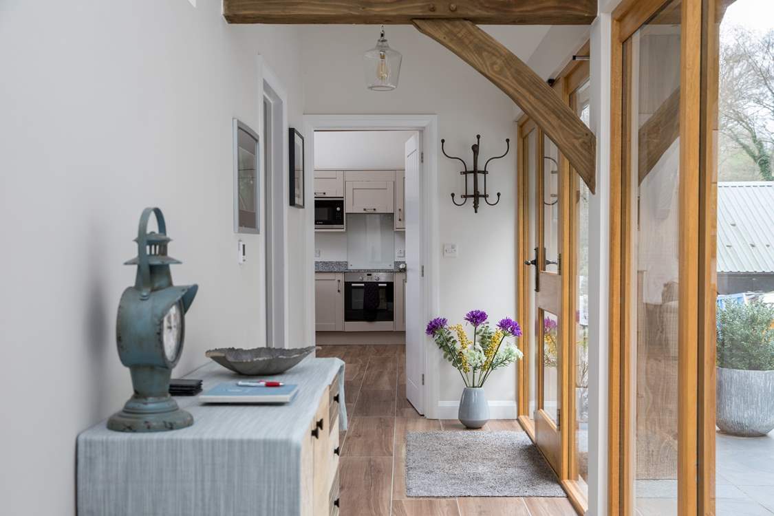 This glass fronted corridor links the bedrooms to the open plan living space.