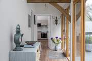 This glass fronted corridor links the bedrooms to the open plan living space.