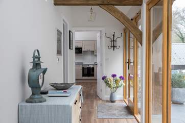 This glass fronted corridor links the bedrooms to the open plan living space.