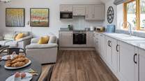 The stylish kitchen-area is spacious and very well-equipped.