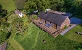 Larch Barn in the foreground with the owner's white Listed cottage in the background. - Thumbnail Image