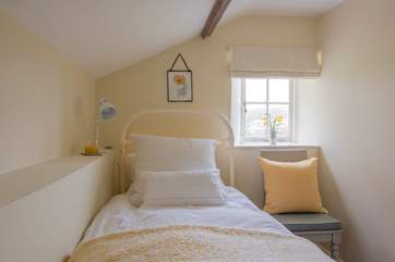The charming single bedroom (please mind the sloping ceiling).