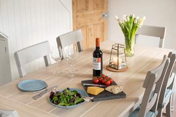 The dining-area sits at the far end of the living-room.