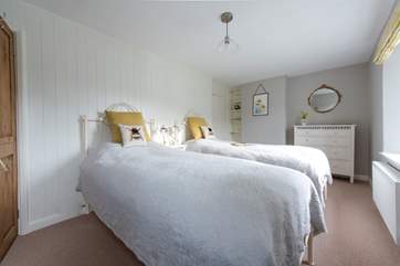 The stylish twin bedroom.