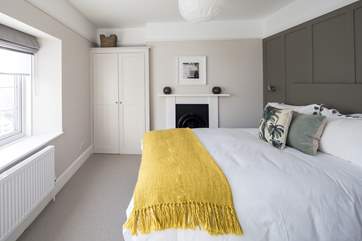 Bedroom 1 is home to this super inviting bed.