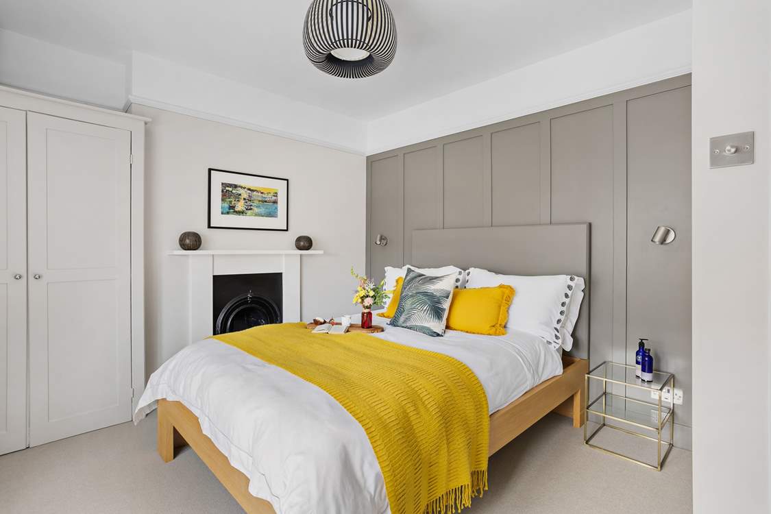 Bedroom 1 is home to this super inviting bed.