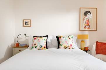 The double bedroom filled with warming tones (Bedroom 2).