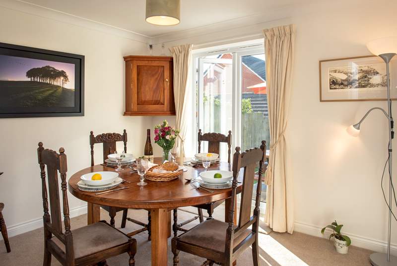 The separate dining-room has patio doors leading out to the garden.