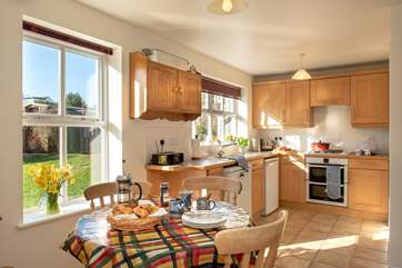 The sunny kitchen/breakfast-room overlooks the back garden.