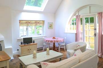 Another view of the sitting-room with dining-area.