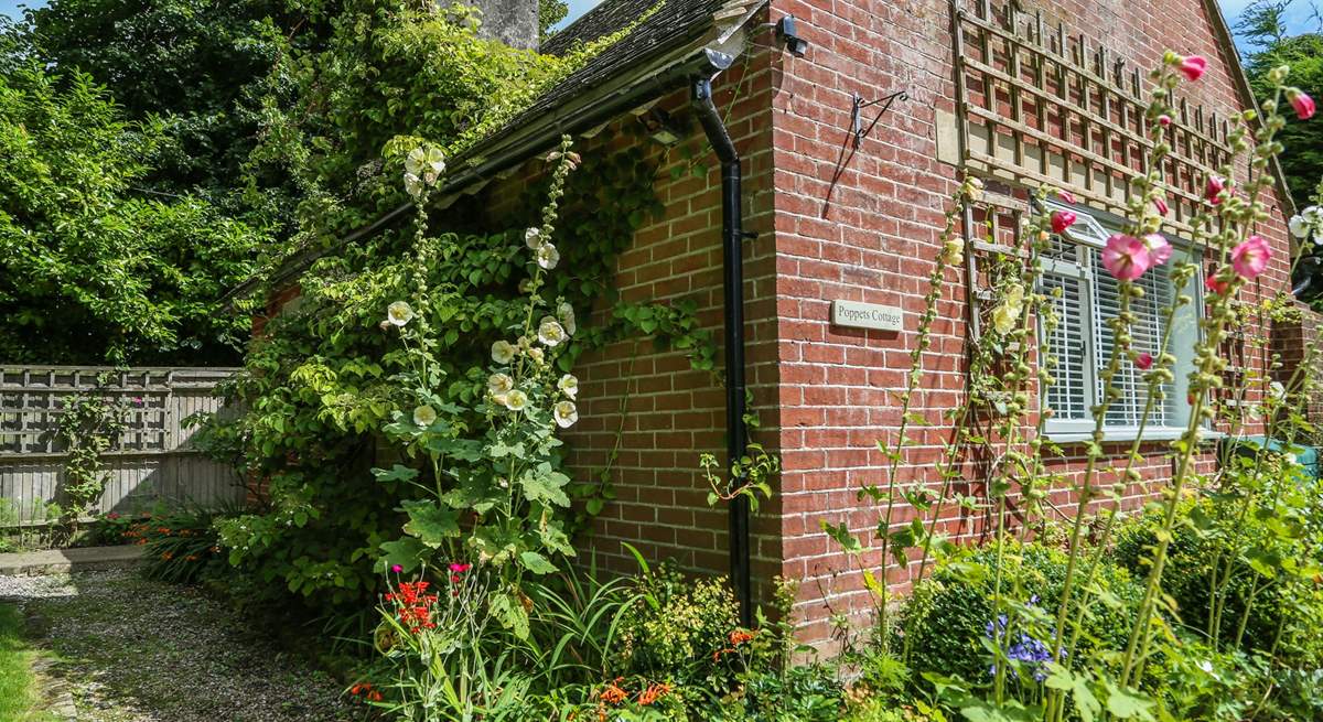 Flowers adorn Poppets Cottage.