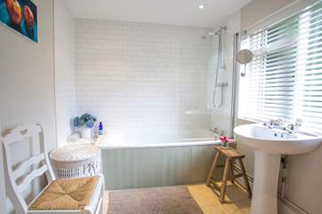 Sink back and relax in the full-size bath after a day out exploring.