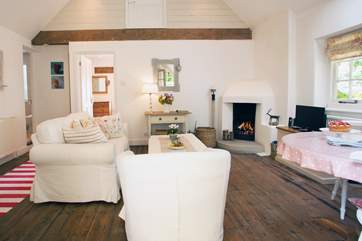 The sitting-room with dining-area has wonderful vaulted ceilings.