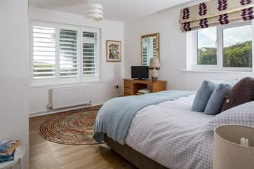 Bedroom 4 is simply delightful. This king-size bed is complemented by oodles of space a TV and wait until you see the view!