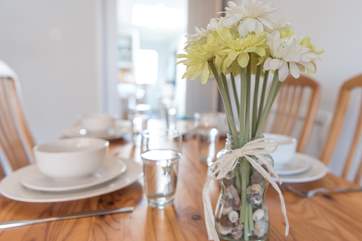 The open plan sitting/dining-room provides plenty of space for its guests