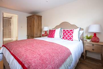The master bedroom has a comfy king-size bed with luxury linen.