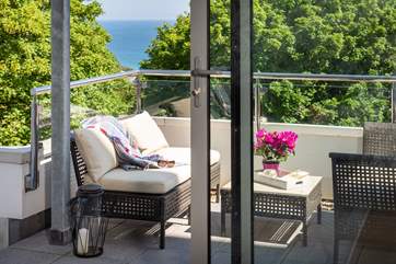 The sunny balcony is the perfect spot for a chilled glass of wine on a summers evening.