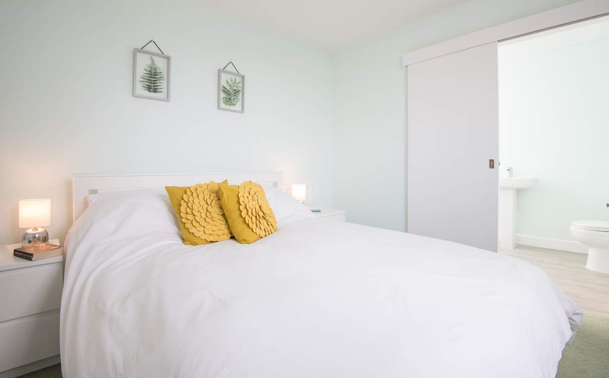 Bedroom 4 is the only room located on the first floor, with its own en suite bathroom and sea glimpses.