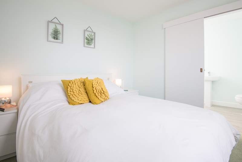 Bedroom four is the only room located on the first floor, with its own en suite bathroom and sea glimpses.